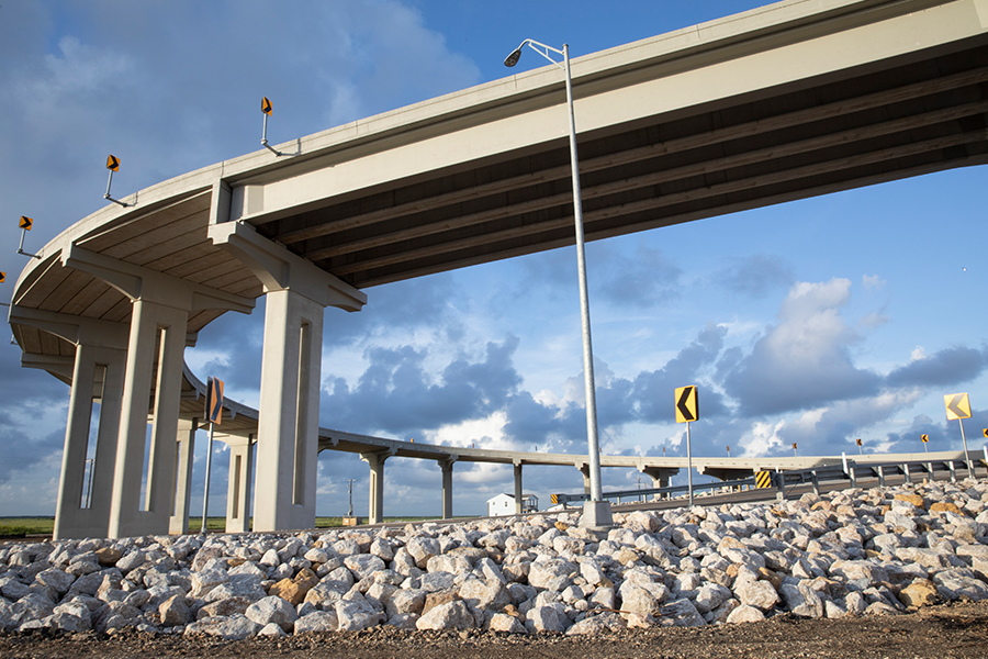 highway bridge over rocky waterway
