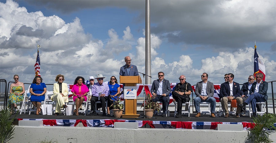 Harbor Bridge ribbon cutting dais Harbor Bridge ribbon cutting ceremony with speakers on a dais.