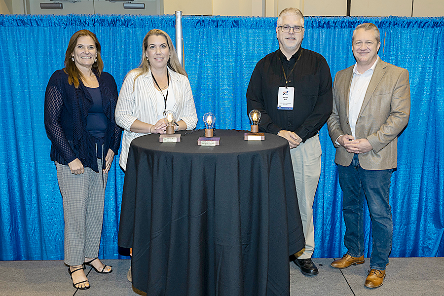 Team Frisco won a STAR Award at the 2025 Texas Innovation Invitational in Fort Worth, Texas, June 16-18, 2025.  L-r:  Erika Kemp, TxDOT; Karen Smith, and Brian Moen, of Team Frisco; Darran Anderson, TxDOT.