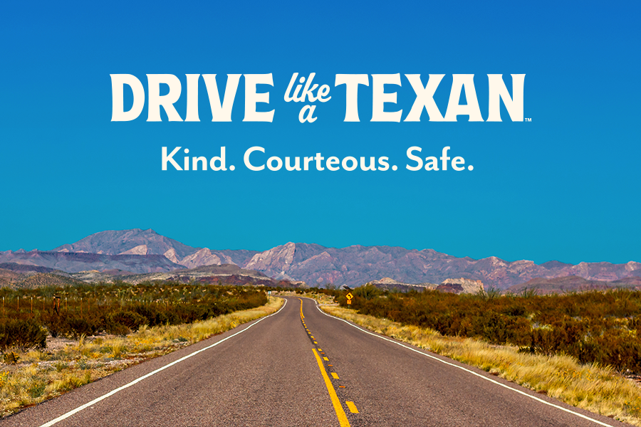 Drive Like a Texan. Kind. Courteous. Safe.
Highway stretching into the distance with mountains on the horizon.