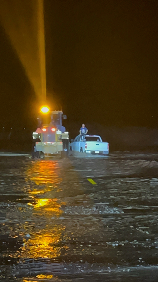 TxDOT maintenance crews used a front-end loader to rescue a man stranded in flood waters in Presidio County.