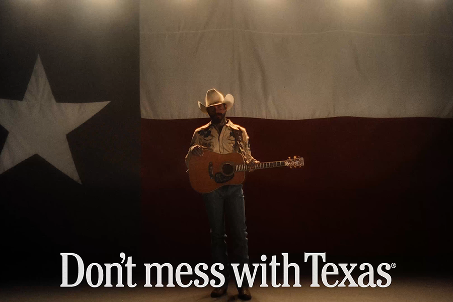Music star Post Malone in front of Texas flag
