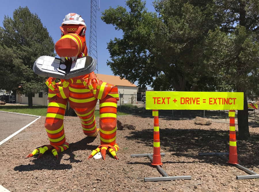 TxDOT T-Rex barrel monster in El Paso.