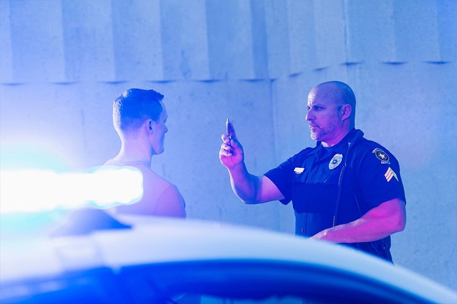 Officer administering DUI test on roadside