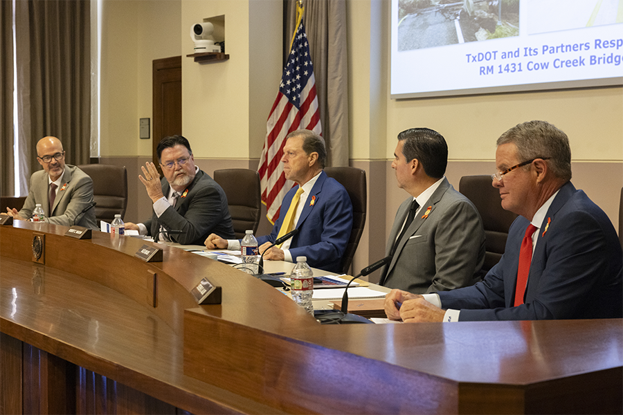 Members of the Texas Transportation Commission seated at long desk