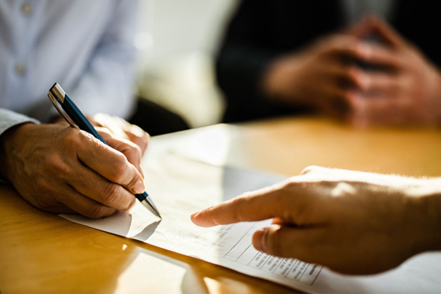 Person signing a contract