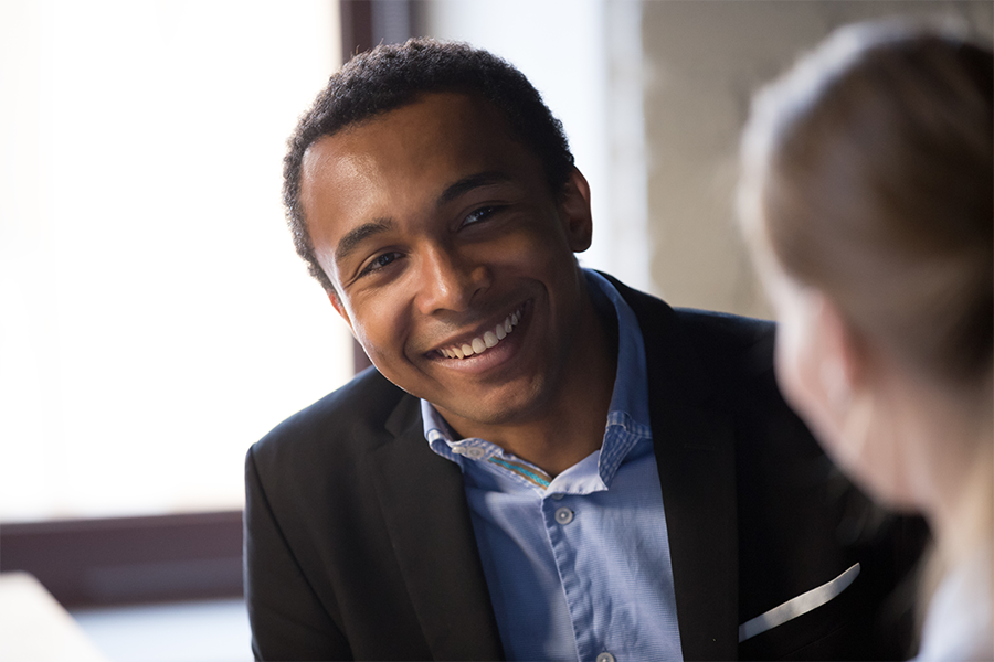 Smiling image of businessman with a client