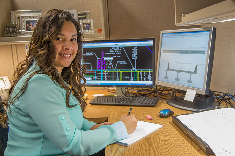 TxDOT employee with computer and notepad