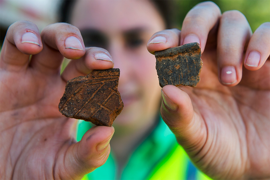 Hands with artifacts archeology