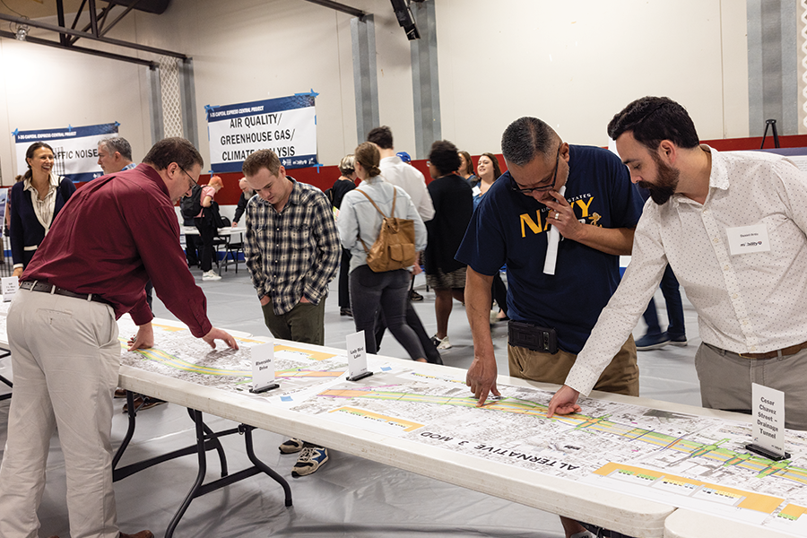 people looking at project construction plans