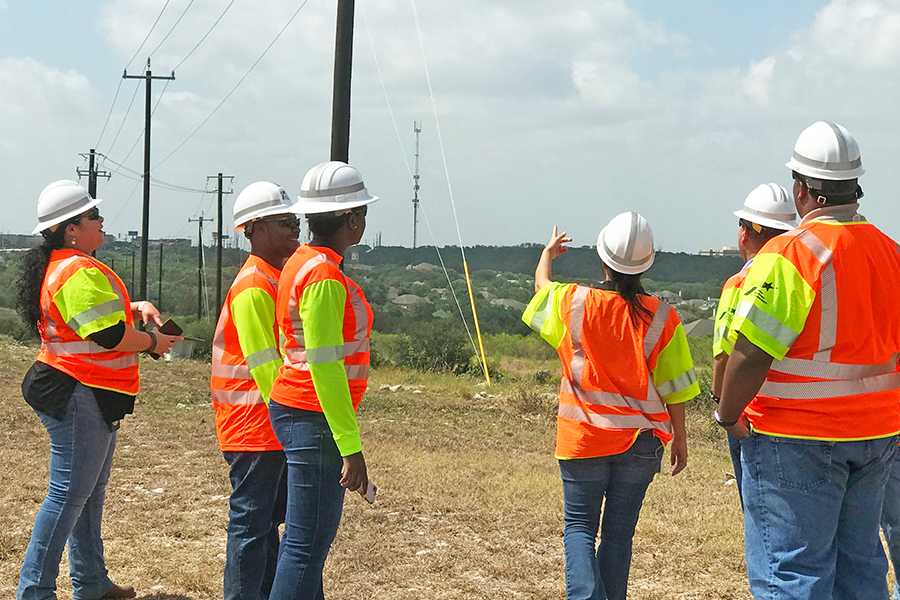 TxDOT crew examines poles