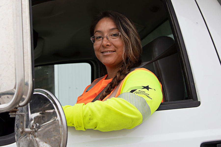 TxDOT employee wearing PPE in driver seat