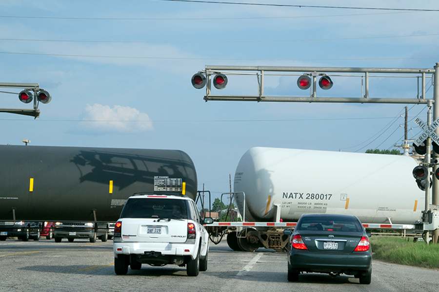 Cars stopped at railroad crossing