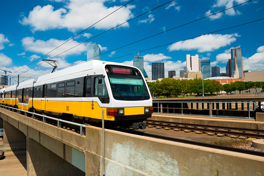 Light rail train and Dallas skyline