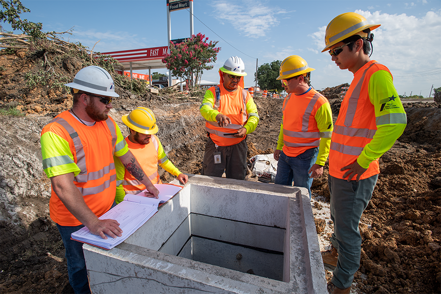 TxDOT crew inspecting plans