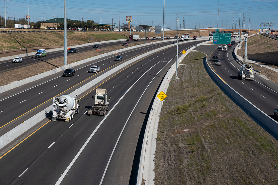 completed highway with trucks moving down