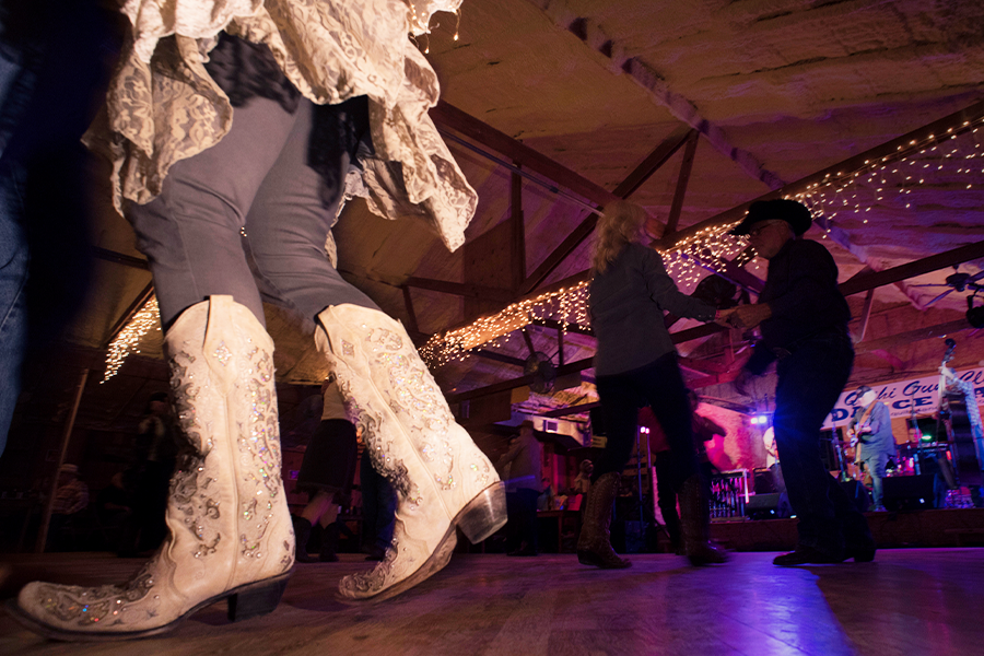 Woman western dancing with white boots