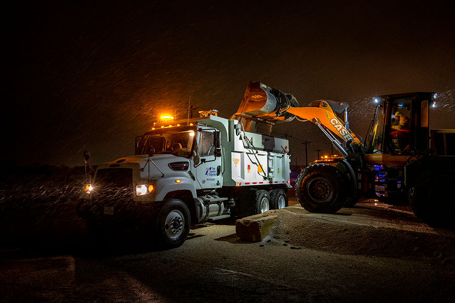 Wheel loader and sand truck Denton maintenance crew