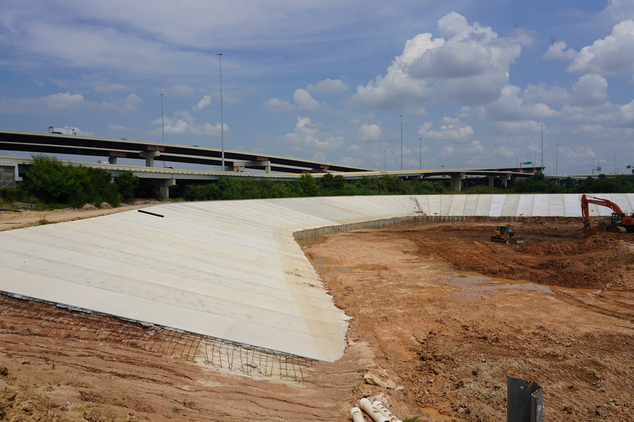 Crews have placed concrete on northwest side of detention pond