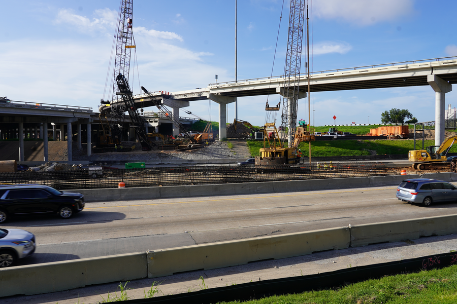 Crews drill holes in between the I-69 southbound and northbound mainlanes, which will house columns for the new Alabama Street bridge